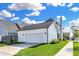 Lovely home with an attached garage, well-kept lawn, a neatly maintained driveway, and beautiful landscaping at 15116 Fenchurch Dr, Westfield, IN 46074