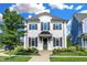 Charming two-story home with white brick, manicured lawn and mature landscaping at 15116 Fenchurch Dr, Westfield, IN 46074