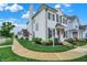 White brick home featuring black shutters, landscaping and a sidewalk running in front of the house at 15116 Fenchurch Dr, Westfield, IN 46074