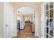 Hallway with hardwood floors that opens to the living and dining area at 15116 Fenchurch Dr, Westfield, IN 46074