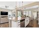 Open concept kitchen boasts granite countertops, stainless steel appliances, and a seamless transition to the living area at 15116 Fenchurch Dr, Westfield, IN 46074
