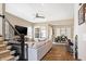 Spacious living room with natural lighting and an open layout to the dining area at 15116 Fenchurch Dr, Westfield, IN 46074