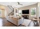 Bright living room with hardwood floors, stairs and large windows at 15116 Fenchurch Dr, Westfield, IN 46074