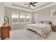 Spacious main bedroom with a ceiling fan and plush neutral carpeting at 15116 Fenchurch Dr, Westfield, IN 46074