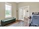 A room featuring a large window, gray walls, hardwood floors and french doors leading to the entryway at 15116 Fenchurch Dr, Westfield, IN 46074