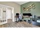 Spacious office featuring hardwood floors, stylish decor, neutral walls and a gray gaming chair at 15116 Fenchurch Dr, Westfield, IN 46074