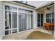 Enclosed patio with tile flooring, a ceiling fan, lots of windows, and sliding glass doors at 15116 Fenchurch Dr, Westfield, IN 46074