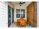 Covered patio including an outdoor dining set and a ceiling fan at 15116 Fenchurch Dr, Westfield, IN 46074