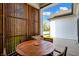Charming porch with a wooden privacy screen and a cozy outdoor dining area at 15116 Fenchurch Dr, Westfield, IN 46074