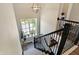Upper-level staircase with an eye-level window offering natural light and neighborhood views at 15116 Fenchurch Dr, Westfield, IN 46074