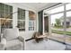 Sunroom with bright windows, comfortable seating, and neighborhood views at 15116 Fenchurch Dr, Westfield, IN 46074