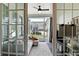 Inviting sunroom featuring a comfortable sofa, area rug, and large windows offering views of the neighborhood at 15116 Fenchurch Dr, Westfield, IN 46074