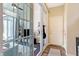 Bright, modern sunroom with sliding glass doors, leading to an interior room with seating and a bookshelf at 15116 Fenchurch Dr, Westfield, IN 46074