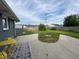 Backyard with a concrete patio, a small shed and a wooden fence at 1718 South Dr, Columbus, IN 47203