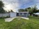 Backyard featuring a concrete patio and a small shed at 1718 South Dr, Columbus, IN 47203