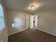 Bedroom featuring a window, neutral walls, plush carpeting and a closet at 1718 South Dr, Columbus, IN 47203