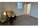 Cozy bedroom features neutral walls, plush carpeting, and a brightly lit reading nook at 1718 South Dr, Columbus, IN 47203