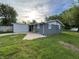Charming single-story home with a brick exterior, a small patio, and a well-maintained lawn at 1718 South Dr, Columbus, IN 47203