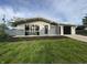 Attractive single-story home with an attached garage, manicured lawn, and inviting exterior paint at 1718 South Dr, Columbus, IN 47203