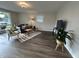 Open living room with laminate flooring, comfortable seating, and an abundance of natural light at 1718 South Dr, Columbus, IN 47203