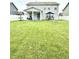 Spacious backyard featuring a stone fire pit, patio with seating, and a well-maintained lawn at 1880 Explorer Ct, Franklin, IN 46131