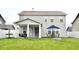 Spacious backyard boasts a patio, fire pit, and well-maintained lawn at 1880 Explorer Ct, Franklin, IN 46131