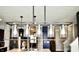 Elegant dining area lighting fixture highlighting the modern design of the kitchen and dining space at 1880 Explorer Ct, Franklin, IN 46131