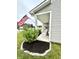 Quaint front porch with charming rocking chairs and lush landscaping, creating a welcoming entryway at 1880 Explorer Ct, Franklin, IN 46131