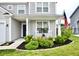 Inviting front porch with rocking chairs and lovely landscaping, perfect for relaxing outdoors at 1880 Explorer Ct, Franklin, IN 46131