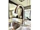 Close-up of a modern kitchen faucet, showcasing the contemporary design of the kitchen space at 1880 Explorer Ct, Franklin, IN 46131