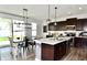 Modern kitchen featuring a large island, stainless steel appliances, and an adjacent dining area at 1880 Explorer Ct, Franklin, IN 46131