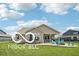 Spacious backyard with a patio featuring outdoor seating, a fire pit, a hot tub, and beautiful landscaping at 19175 English Lake Ln, Noblesville, IN 46062