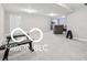 Finished basement area offering fitness equipment, seating, and ample space for recreation and relaxation at 19175 English Lake Ln, Noblesville, IN 46062