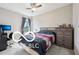Bedroom with black-out curtains and a view to the backyard at 19175 English Lake Ln, Noblesville, IN 46062