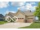 Beautifully landscaped home featuring a three-car garage and attractive architecture at 19175 English Lake Ln, Noblesville, IN 46062
