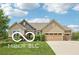 Charming single-story home with a well-maintained lawn and a two-car garage at 19175 English Lake Ln, Noblesville, IN 46062