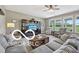 Cozy living room features a large sectional sofa, media center, and natural light at 19175 English Lake Ln, Noblesville, IN 46062