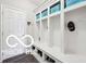 Mudroom featuring white built-in storage lockers and cabinets at 19175 English Lake Ln, Noblesville, IN 46062