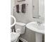 Compact powder room with pedestal sink and toilet at 19175 English Lake Ln, Noblesville, IN 46062
