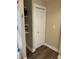 Bathroom interior showcasing modern flooring, a linen closet with shelving, and updated fixtures at 1931 E 68Th St, Indianapolis, IN 46220