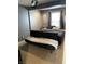 Comfortable bedroom with a futon and a window that lets in plenty of natural light, creating a cozy atmosphere at 1931 E 68Th St, Indianapolis, IN 46220