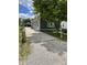 Charming home with blue siding, white trim, a long driveway, and a detached garage at 1931 E 68Th St, Indianapolis, IN 46220