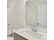 Bathroom vanity with a white quartz countertop and a brushed-nickel faucet fixture over wood-look flooring at 19584 Atwater Ave, Sheridan, IN 46069
