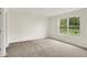 Well-lit bedroom with a large window overlooking a green lawn at 19584 Atwater Ave, Sheridan, IN 46069