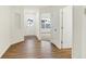 Bright entryway featuring wood-look floors, white walls, and a door with glass inserts at 19584 Atwater Ave, Sheridan, IN 46069