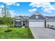 Beautiful home with a well-maintained lawn, manicured landscaping, and a spacious driveway at 19584 Atwater Ave, Sheridan, IN 46069