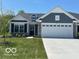 Charming single-story home showcasing a 2-car garage, stone accents, and beautiful curb appeal at 19584 Atwater Ave, Sheridan, IN 46069