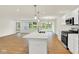 Modern kitchen with stainless appliances, granite countertops, and an open floor plan at 19584 Atwater Ave, Sheridan, IN 46069