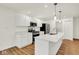 Bright kitchen with white cabinets, stainless steel appliances, and quartz countertops at 19584 Atwater Ave, Sheridan, IN 46069