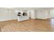 Spacious open-concept living area featuring wood floors, a kitchen, and lots of natural light at 19584 Atwater Ave, Sheridan, IN 46069